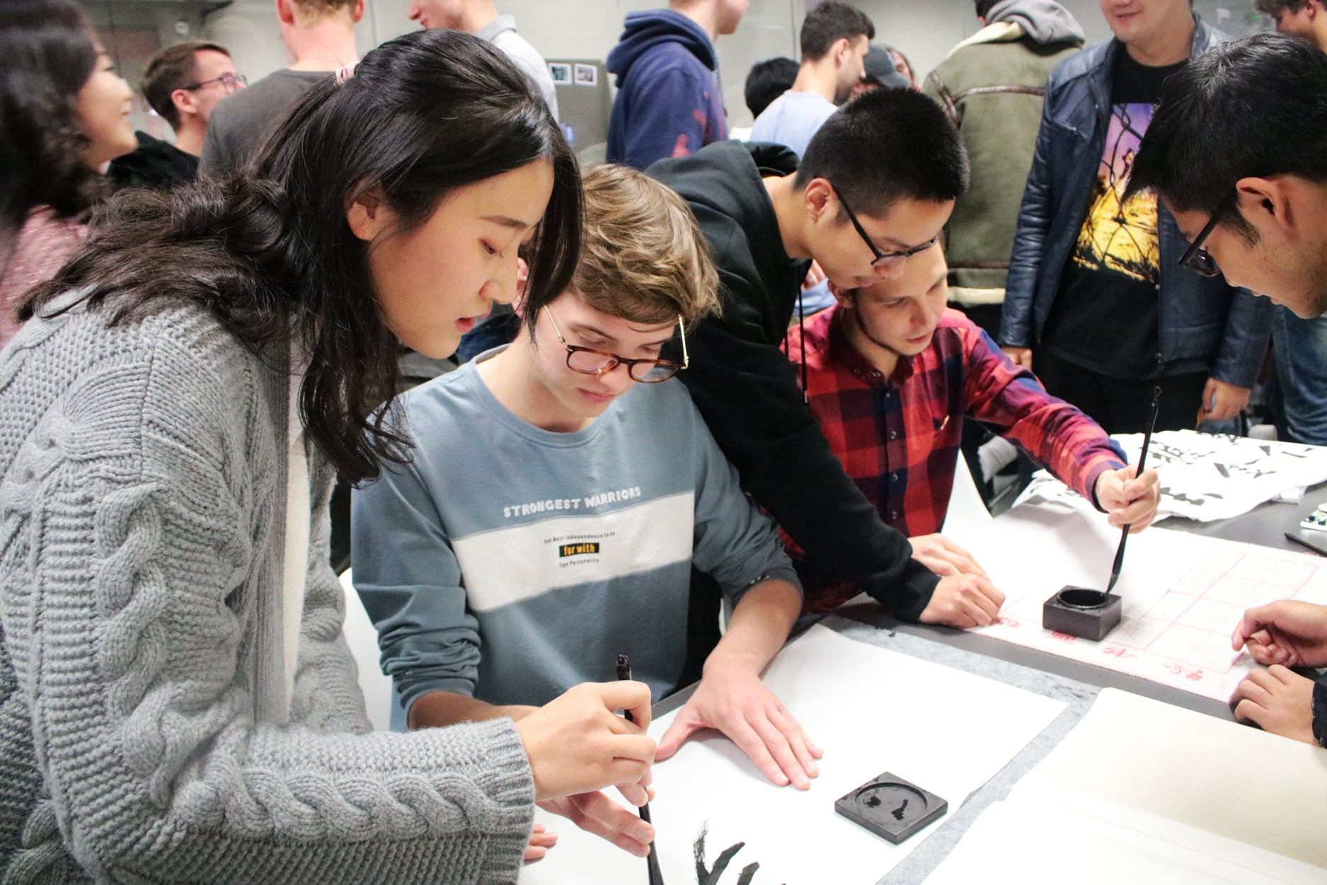 students practicing calligraphy- study business at CUHK Shenzhen